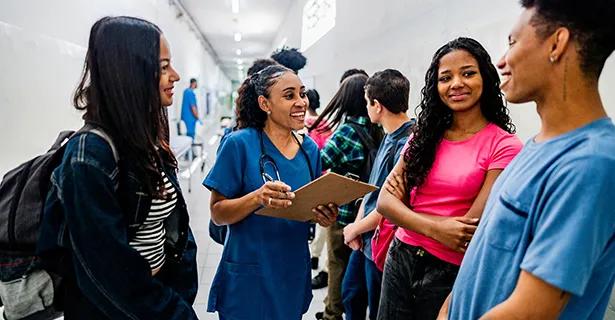 Nurse speaking with school students