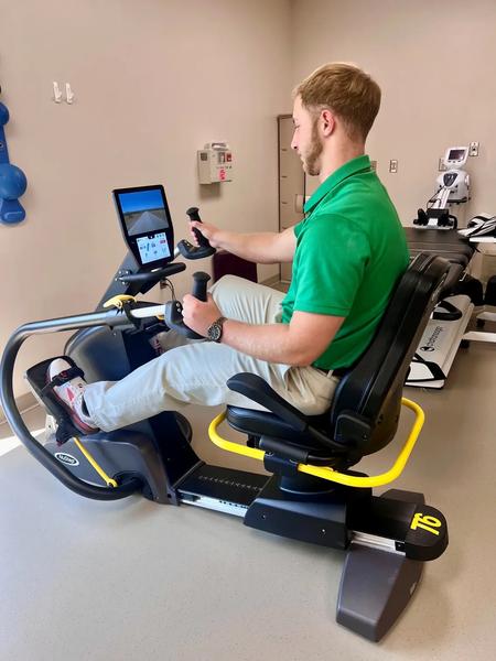 Patient utilizing cross training machine