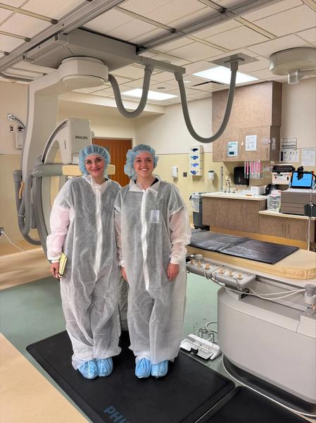 Two purdue students standing by imaging machine