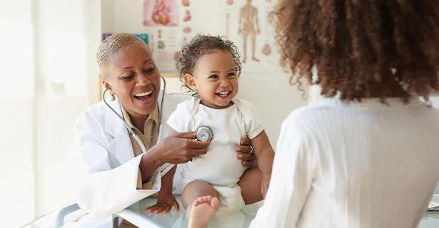 Pediatrician doctor examining a baby