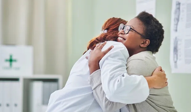 Provider hugging patient