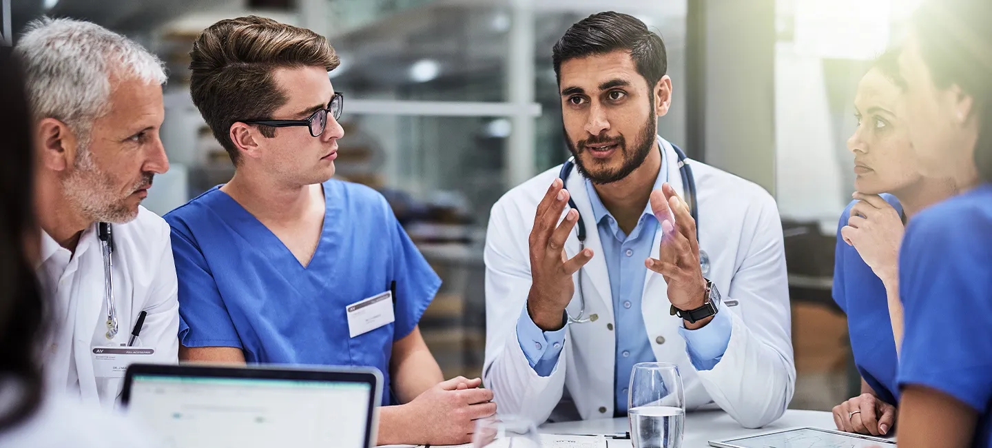 Doctor talking to team